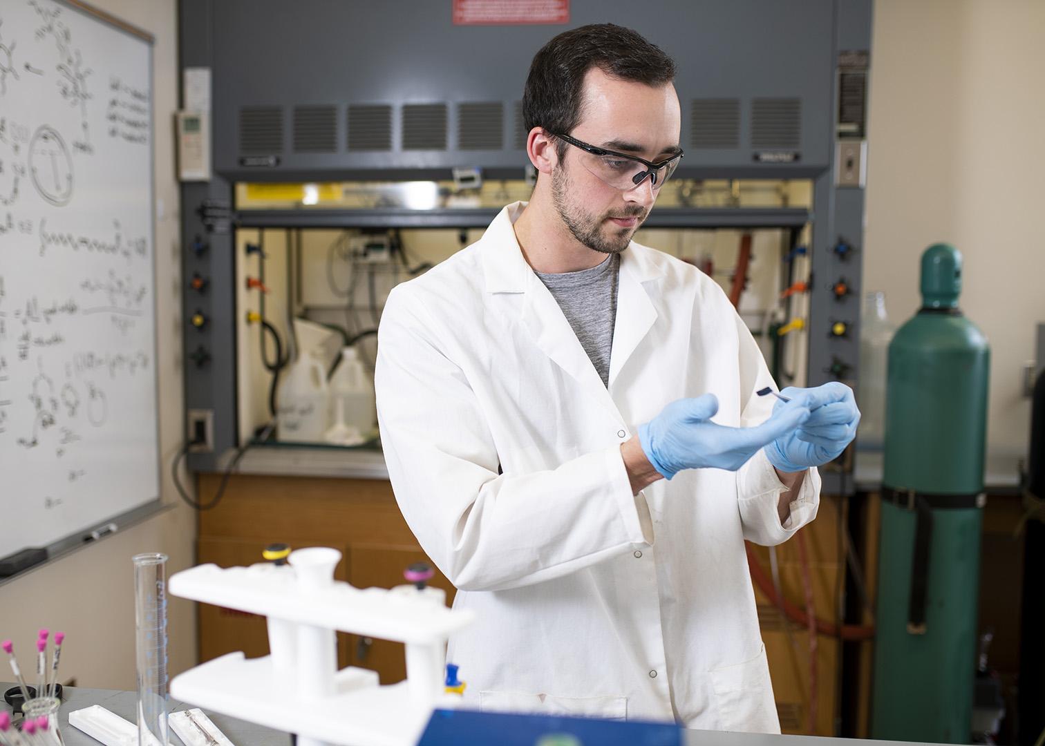 male student in a lab